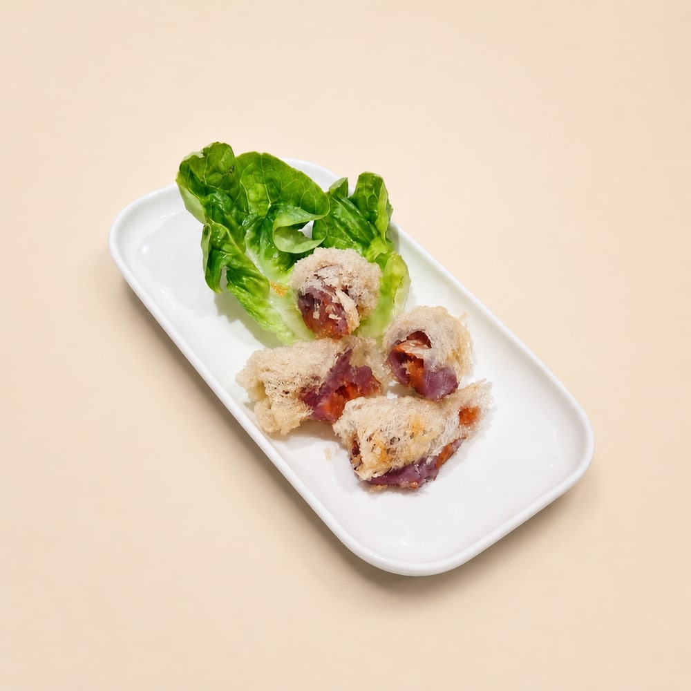 Crispy vegetarian taro rolls served with lettuce